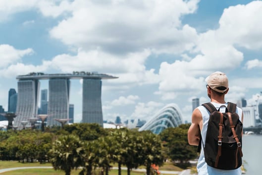 Young man looking at Singapore skyline
