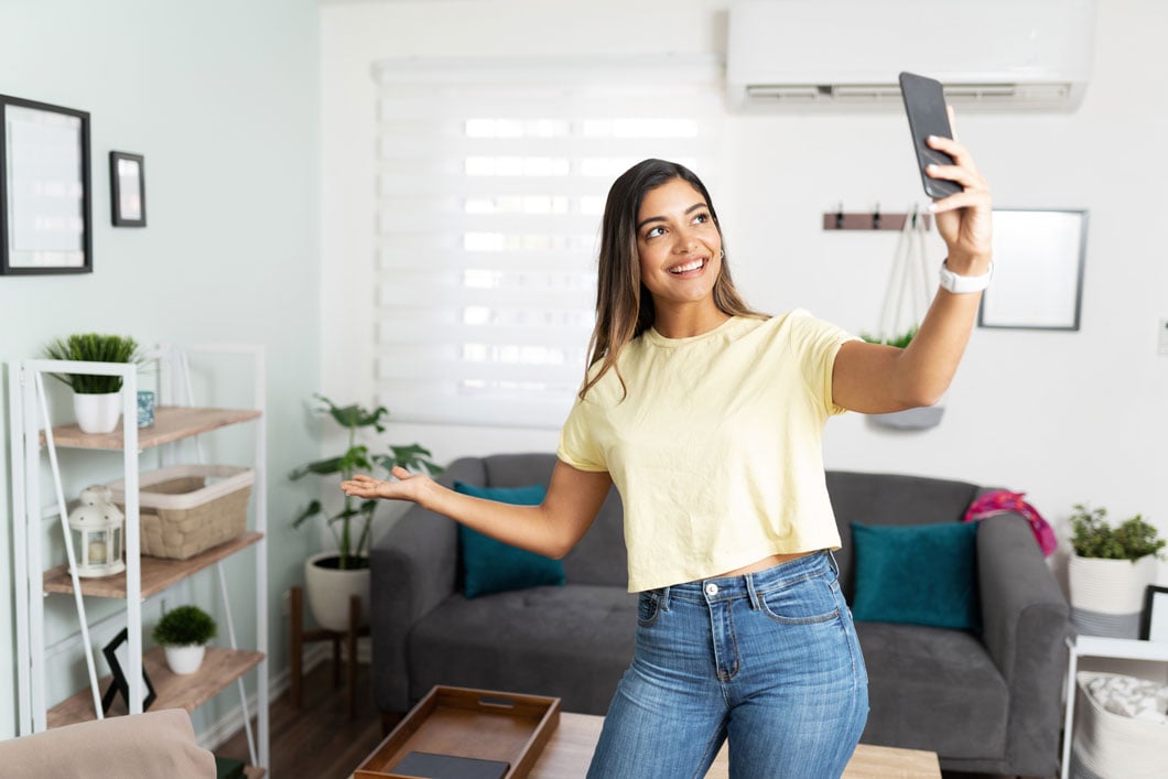 Young woman showing her apartment on video call