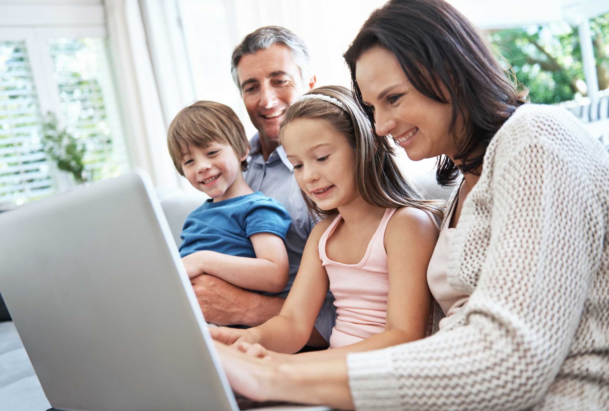 family-using-laptop-at-home