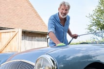 mature-man-cleaning-car